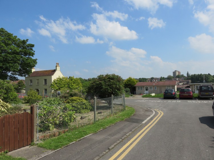 Prefabs and a surviving Georgian building at Sycamore Close, St. George