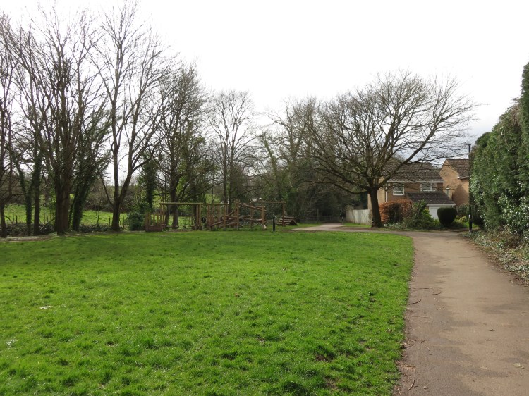 Alongside the brook at Gardners Walk Play Area