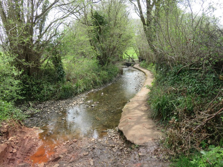 The byway merges with a stream